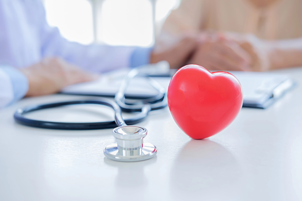 Red heart with stethoscope. Concept healthcare.